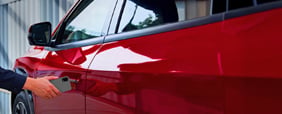 Once you've arrived, tap your iPhone, Apple Watch, or Android phone on the door handle to lock the vehicle.